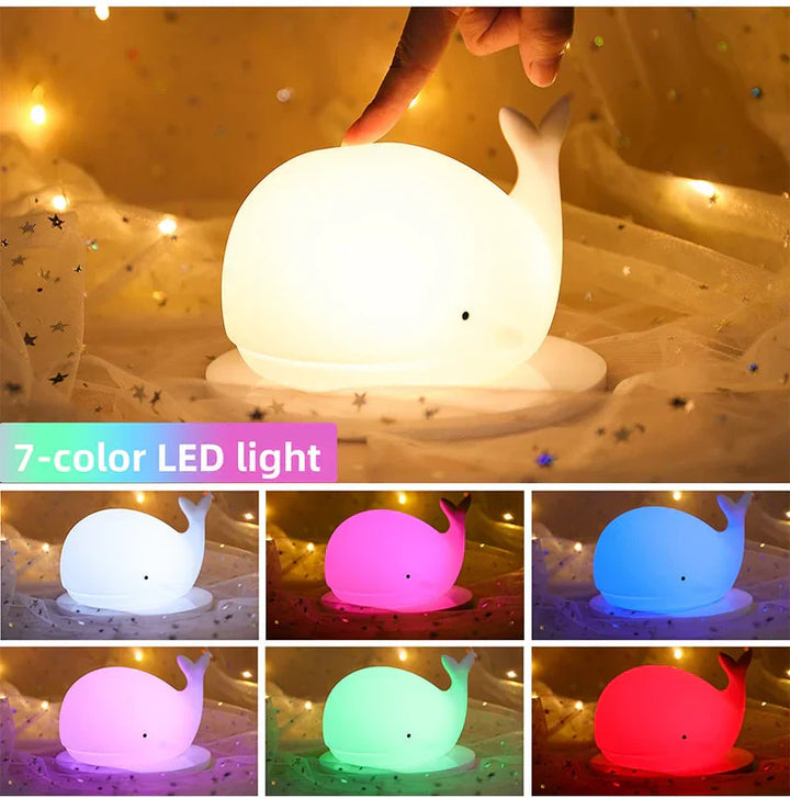 Soft silicone whale night light, color changing for a calming nursery ambiance. Perfect bedtime aid for kids.