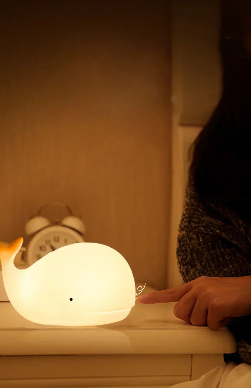GlowWhale LED night light, adorable whale design with soothing color change, ideal for kids' bedtime & nursery.