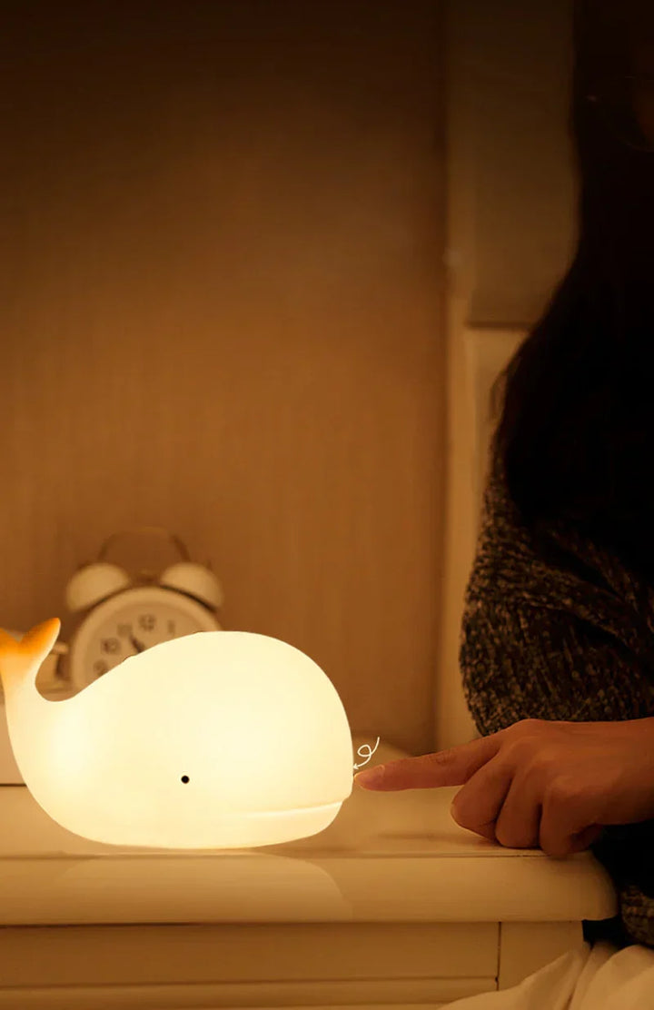 GlowWhale LED night light, adorable whale design with soothing color change, ideal for kids' bedtime & nursery.