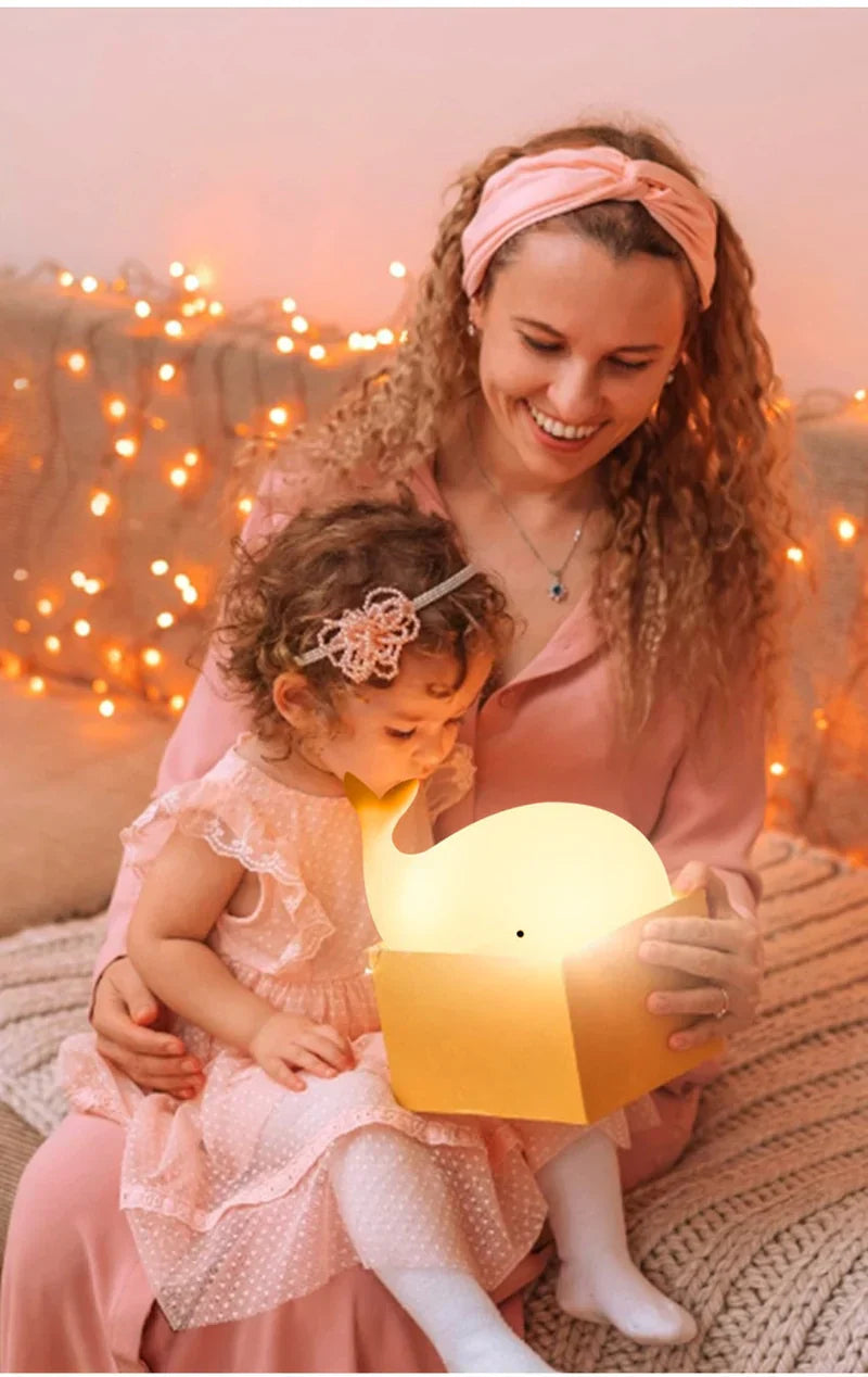 Child-friendly whale lamp, color-changing LED night light, creates a soothing glow for kids' bedroom decor.