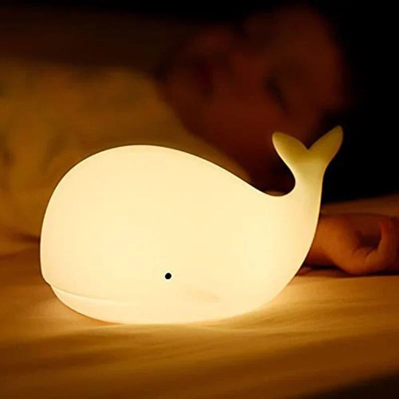 Whale-shaped silicone night light for kids, with gentle color change for a relaxing and cozy bedtime atmosphere.
