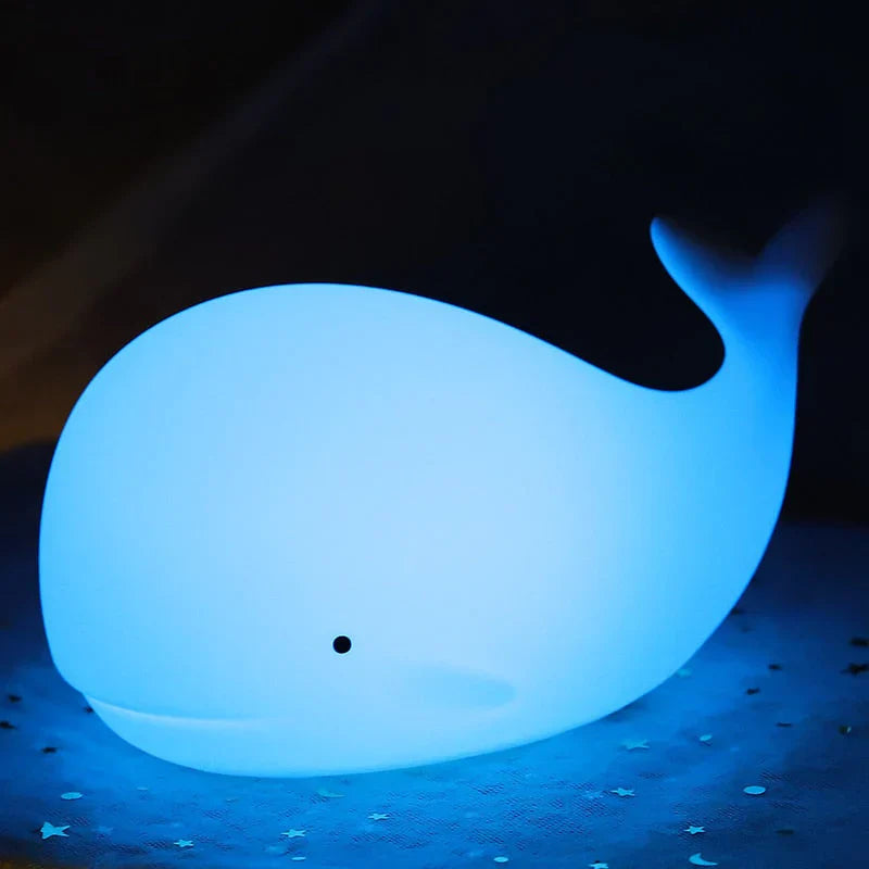 Soothing color-changing LED whale night light, soft silicone touch, perfect for children's bedroom & nursery.