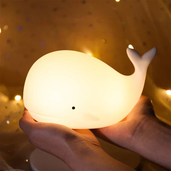 Adorable GlowWhale night light, color changing LED lamp, a charming and calming addition to any nursery decor.