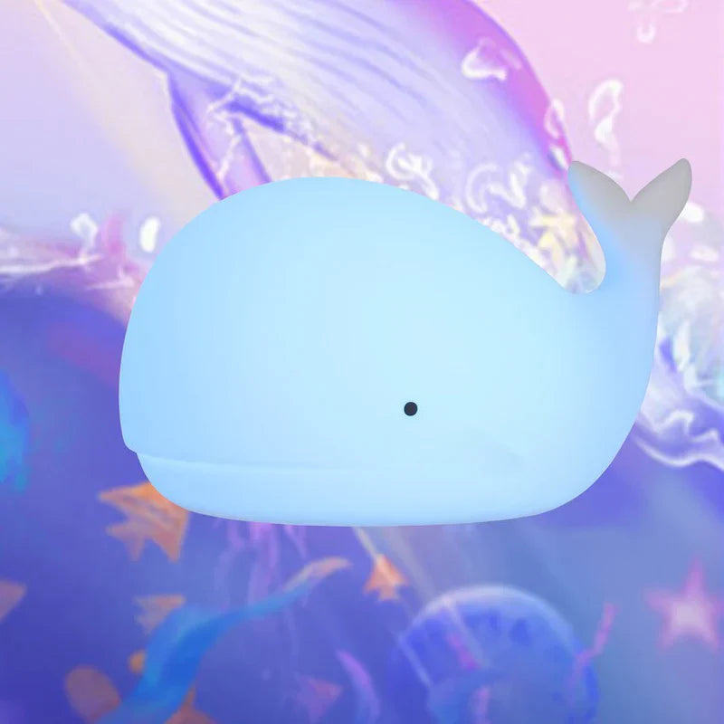 Kids' cute whale night light, provides soothing color-changing glow, ideal for children's bedtime and comfort.