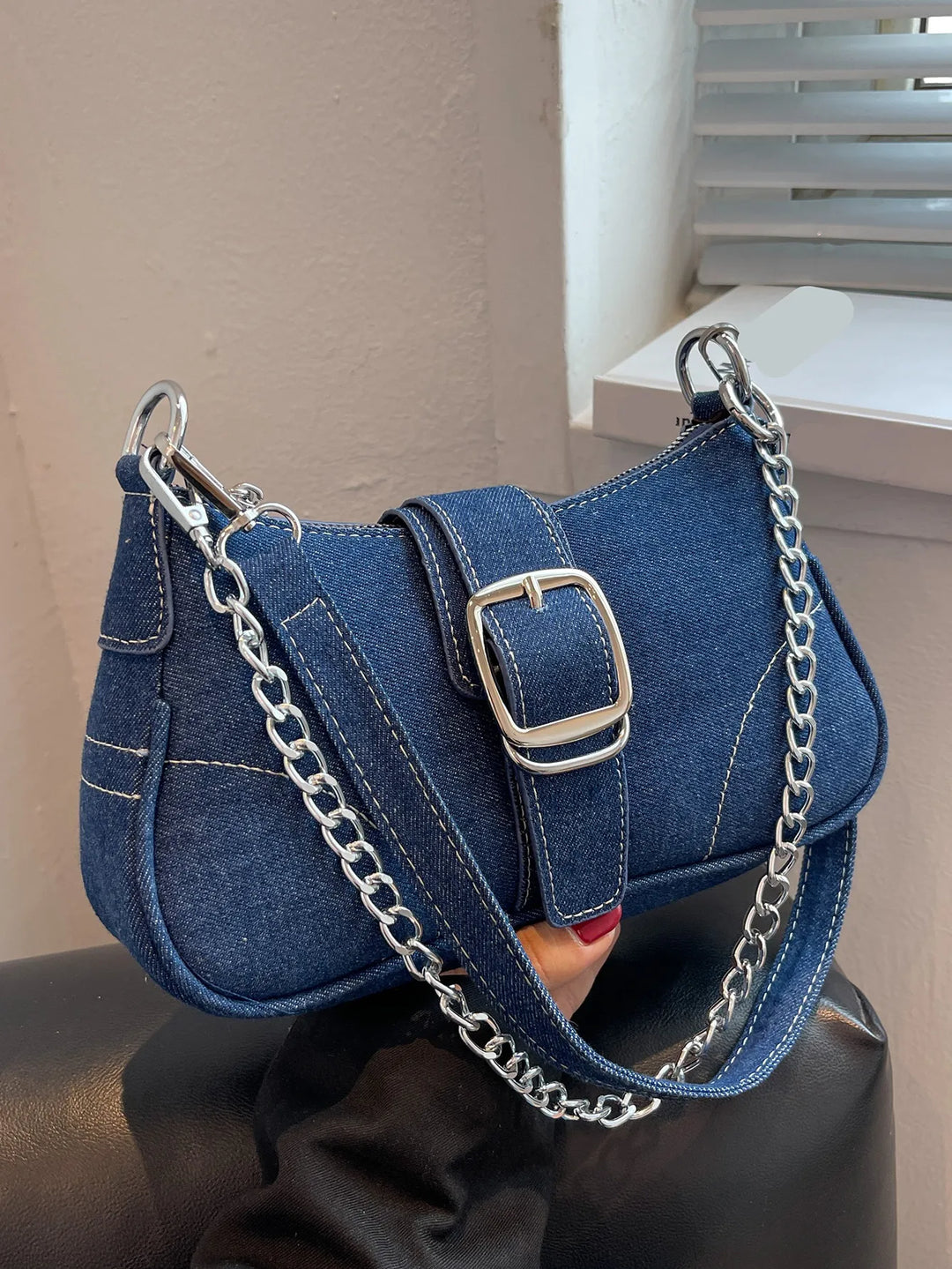 Dark blue women's two-way buckle shoulder handbag, versatile everyday fashion accessory.