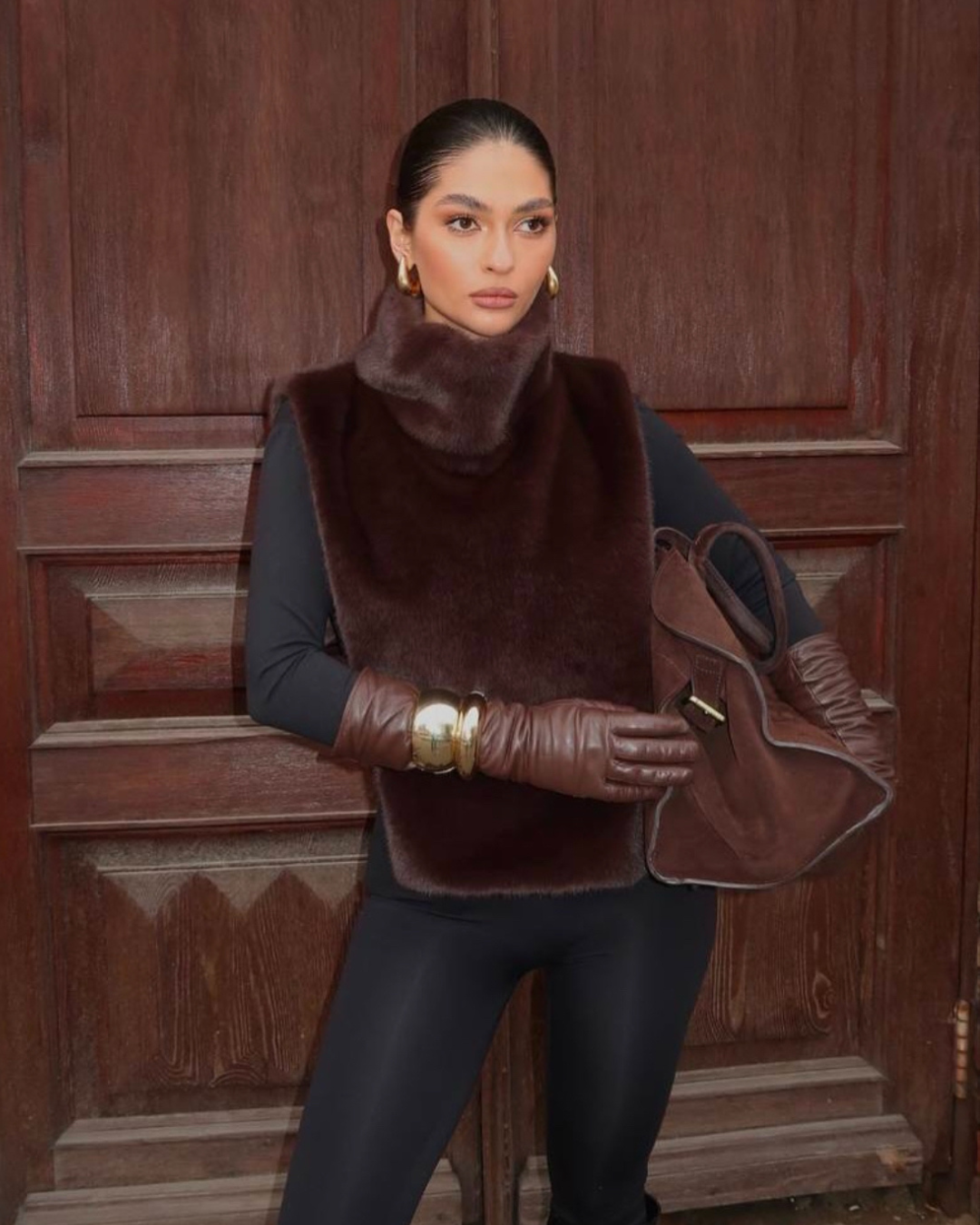 Elegant women's dark brown faux fur turtleneck vest, a must-have sleeveless item for winter fashion.