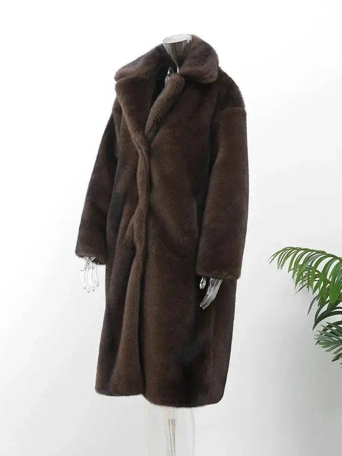 Elegant women's dark brown plush winter coat. Long, cozy, and warm for ultimate cold weather comfort.