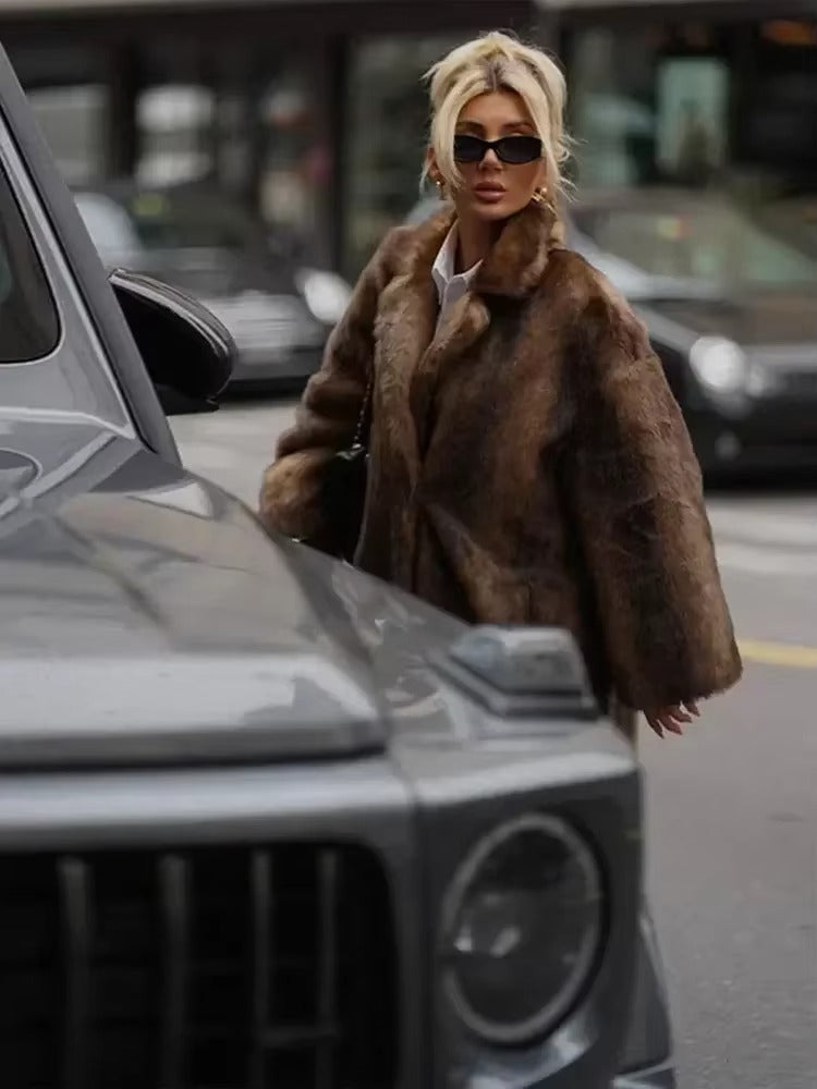 Women's dark brown plush winter coat. A long, warm, oversized fit jacket, perfect for cold weather elegance.