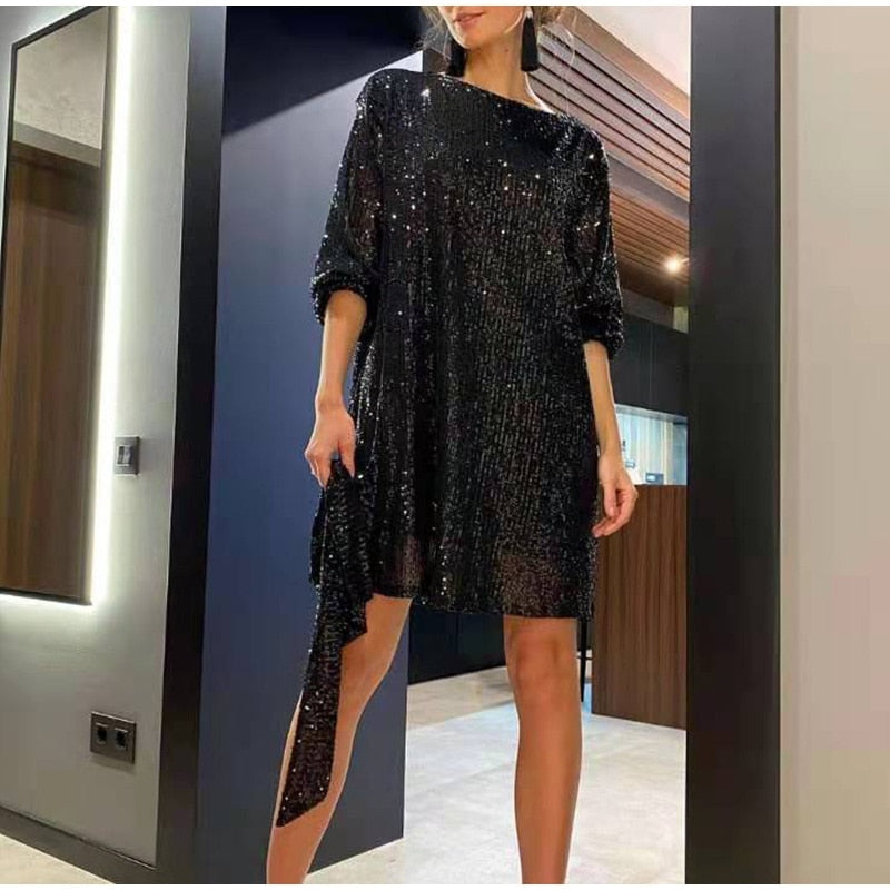 Shimmering women's short sequin dress, a long-sleeve cocktail party outfit suitable for holiday events.