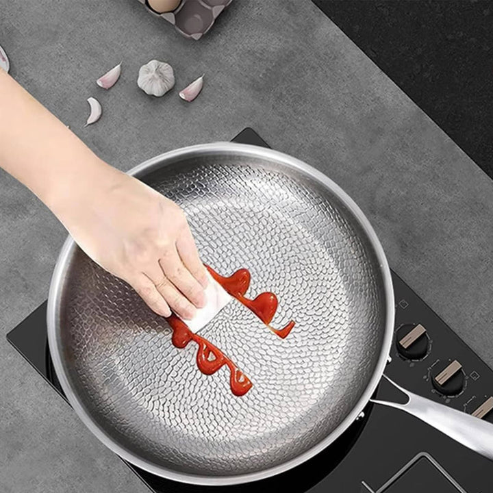 Premium deep non-stick titanium frying pan with unique fish scale texture, superior for even heat cooking.