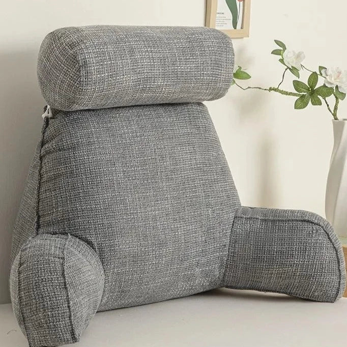 "Deluxe backrest pillow with arms and headrest in cream, featuring a soft-touch finish and side pocket for added convenience.