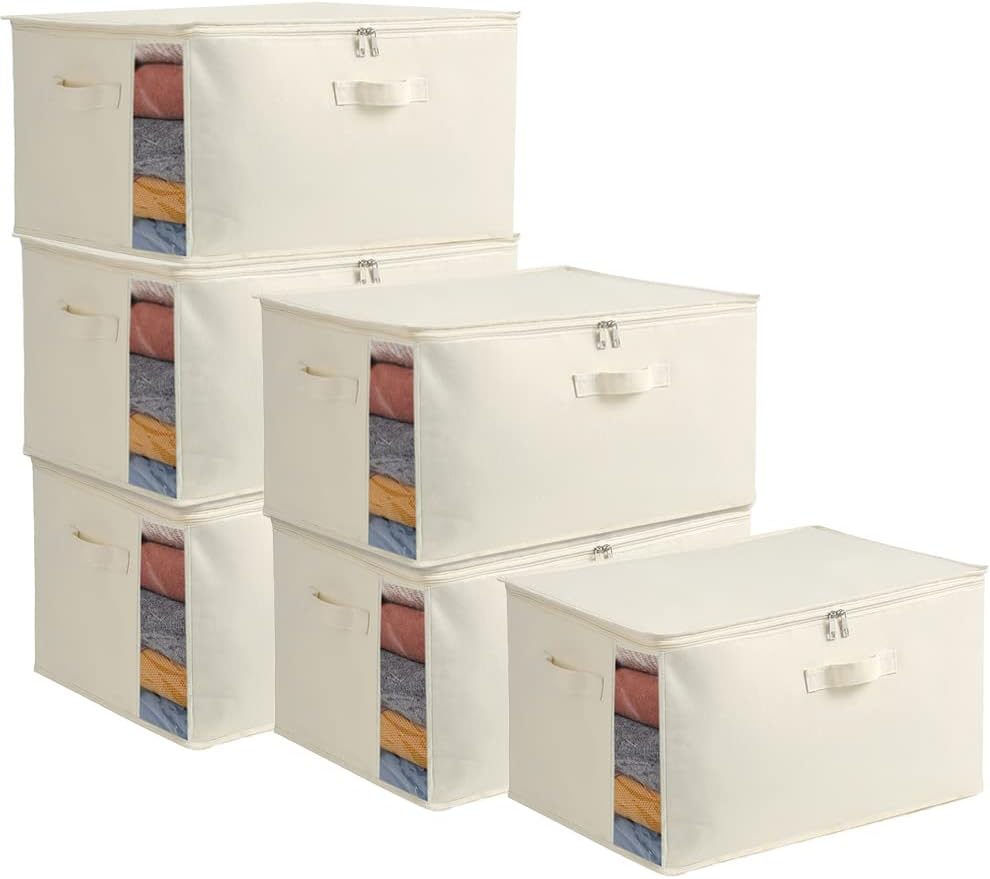 Portable canvas clothes storage bin with clear window and sturdy side handles.