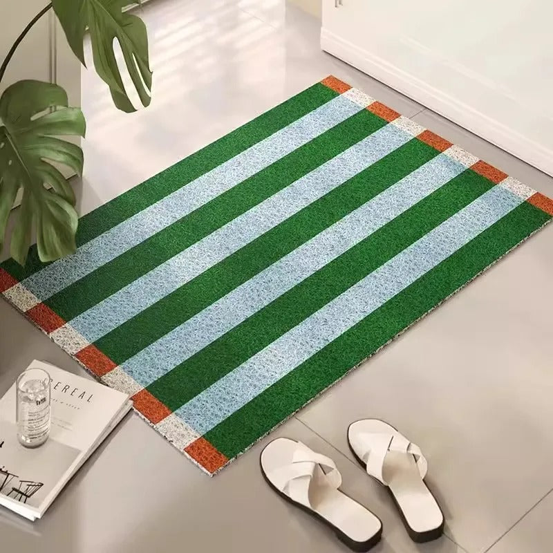 Striped outdoor entryway mat. Durable PVC welcome floor mat with modern home decor design.