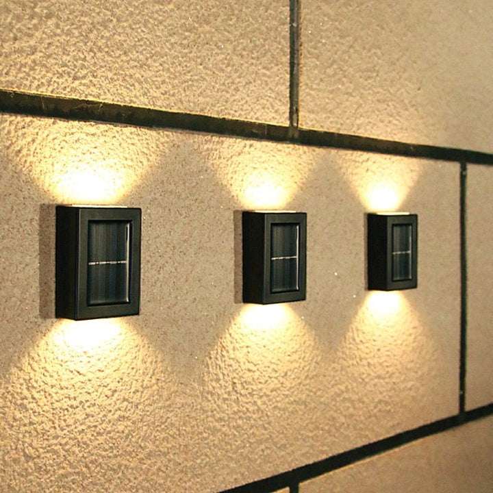 Eco-friendly outdoor solar wall light with modern design, emits warm glow, weather-resistant for gardens and patios.