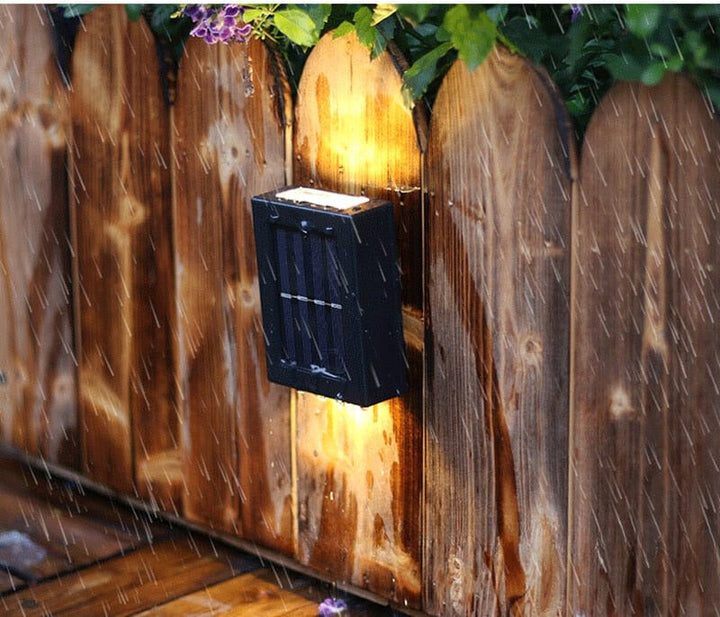 Eco-friendly outdoor solar wall light with modern design, emits warm glow, weather-resistant for gardens and patios.