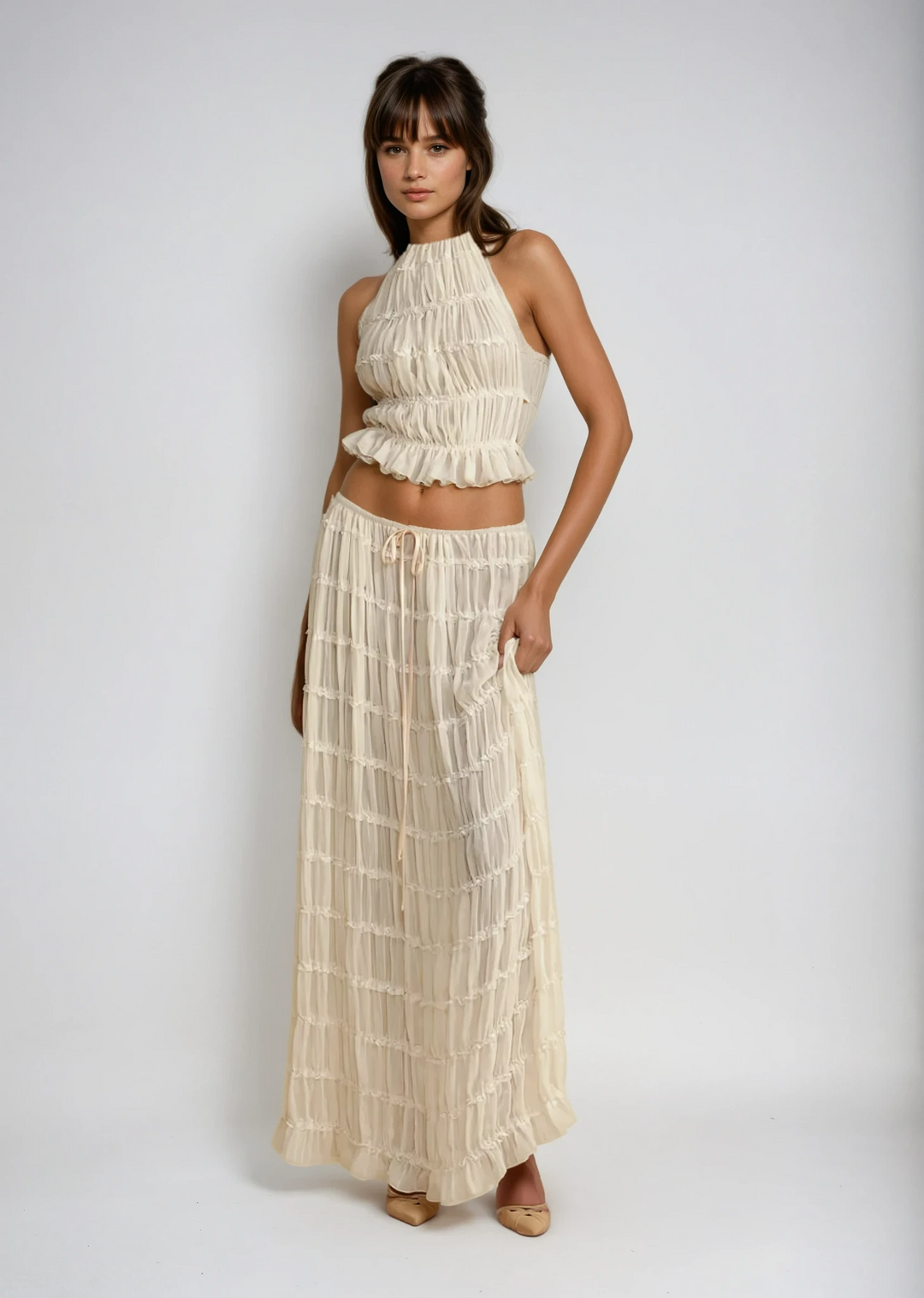 Effortless Women's two-piece summer maxi skirt set with halter top, ideal for beach or resort.