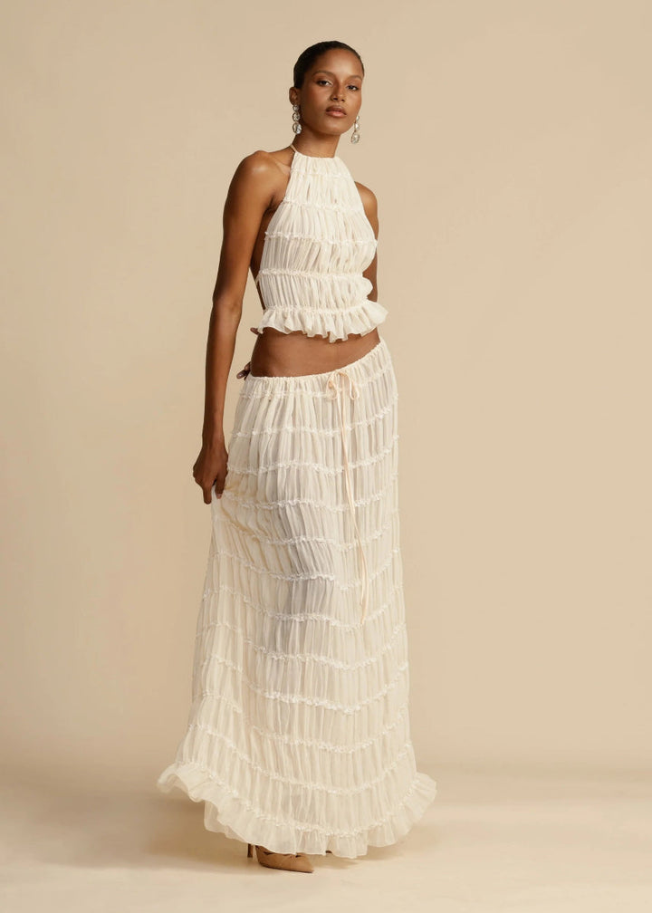 Women's two-piece set: elegant halter top and flowing maxi skirt for summer casual wear.