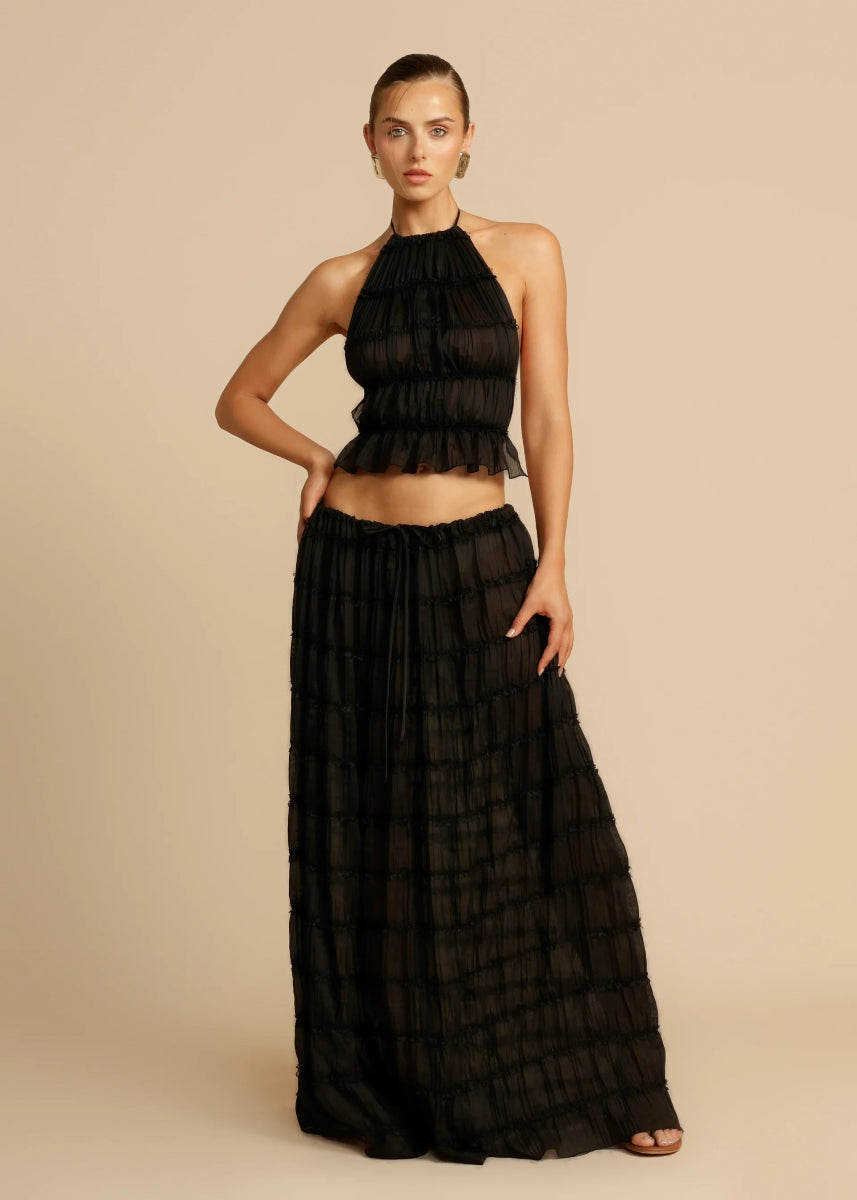Women's casual two-piece summer set: halter top & flowing maxi skirt. Ideal for resort & vacation.