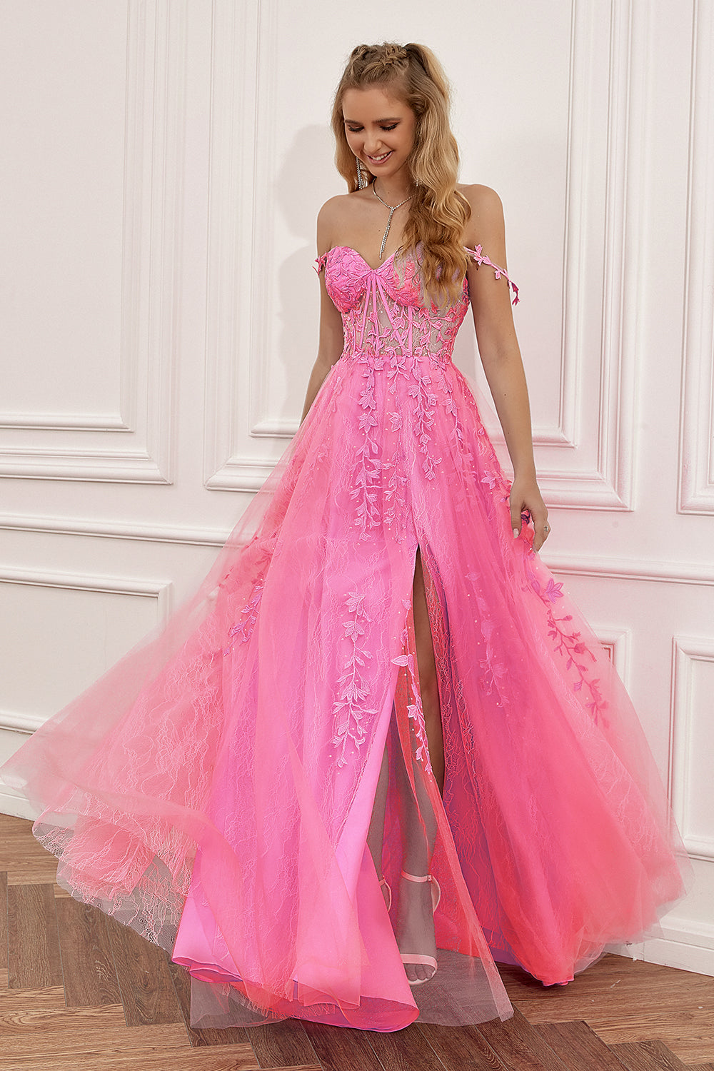 Women's A-line ball gown with appliques and spaghetti straps, ideal for any formal or special occasion.
