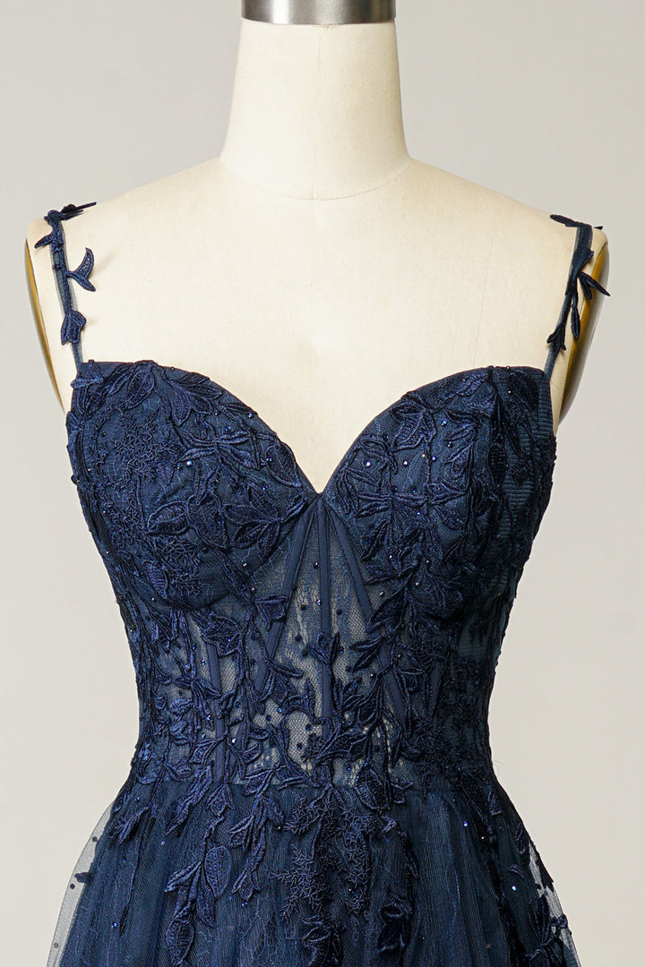 Pink A-line evening gown with detailed appliques and spaghetti straps, perfect for wedding guests.