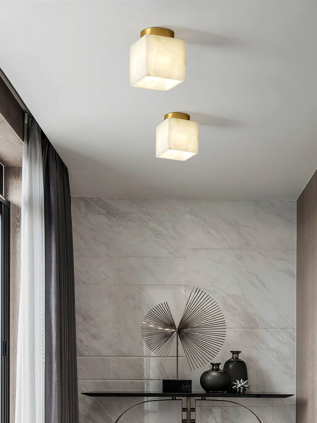 Elegant alabaster brass ceiling lamp, warm ambient light, celestial glow, sophisticated brass detailing, modern design.