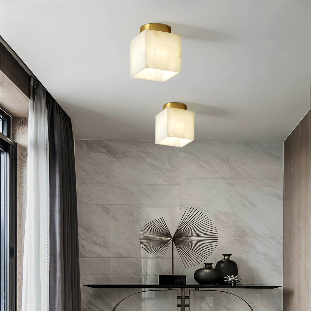 Elegant alabaster brass ceiling lamp, warm ambient light, celestial glow, sophisticated brass detailing, modern design.