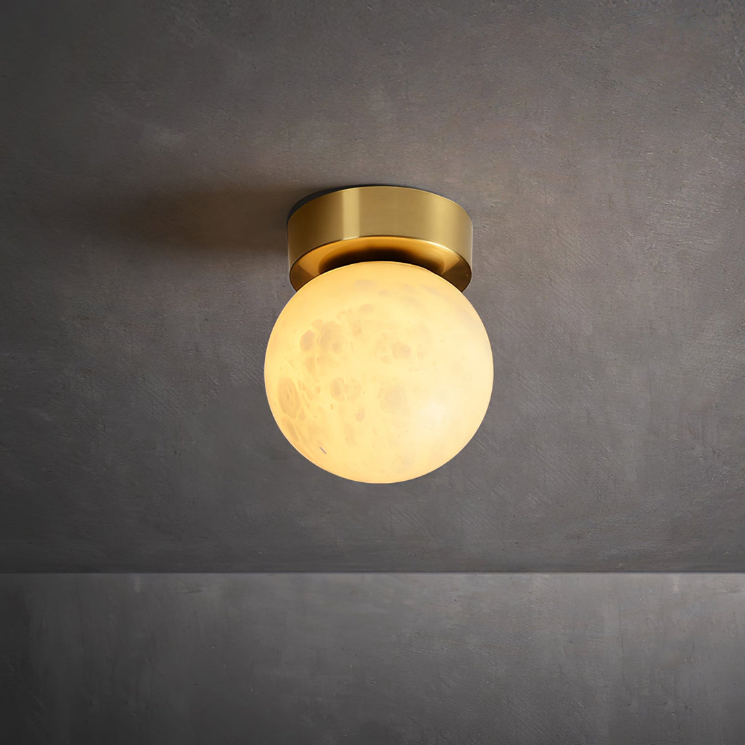 Elegant alabaster brass ceiling lamp, warm ambient light, celestial glow, sophisticated brass detailing, modern design.
