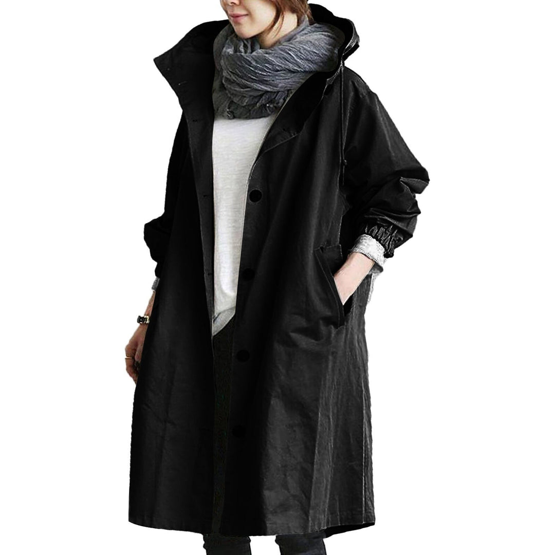Elegant beige long waterproof raincoat for women with adjustable hood and pockets, provides style and protection in rain.