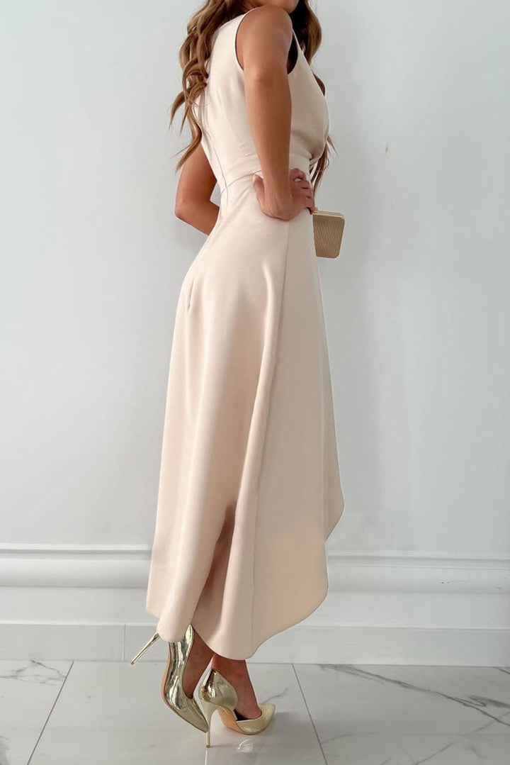 Women's elegant beige wrap maxi dress with a flattering V-neck and asymmetrical hem, ideal for special occasions.