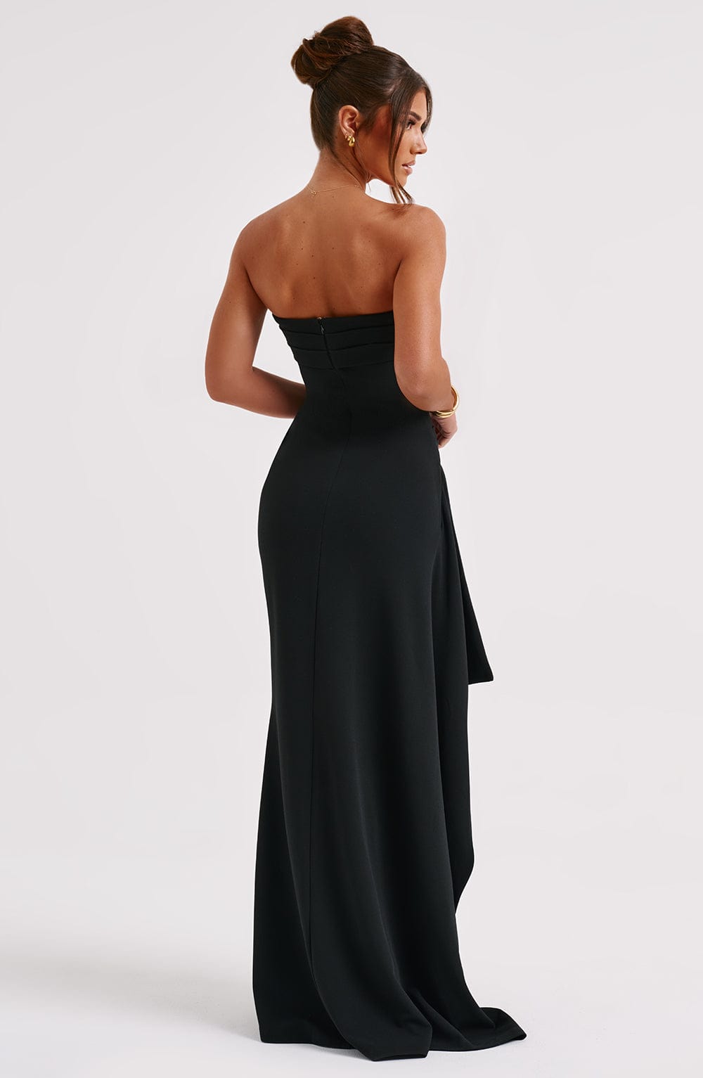 Sophisticated women's black evening gown; a glamorous strapless maxi dress with high slit for special occasions.