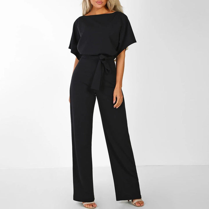"Elegant black women's belted wide-leg jumpsuit, chic design accentuates waist for a sophisticated look, versatile style."