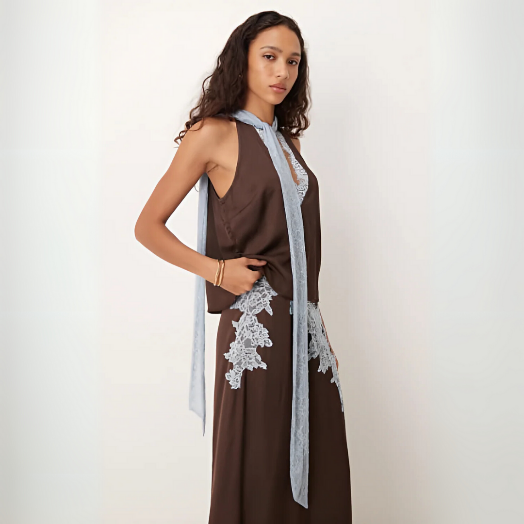 Women's sophisticated two-piece brown matching set with delicate lace panels on top and a chic skirt.