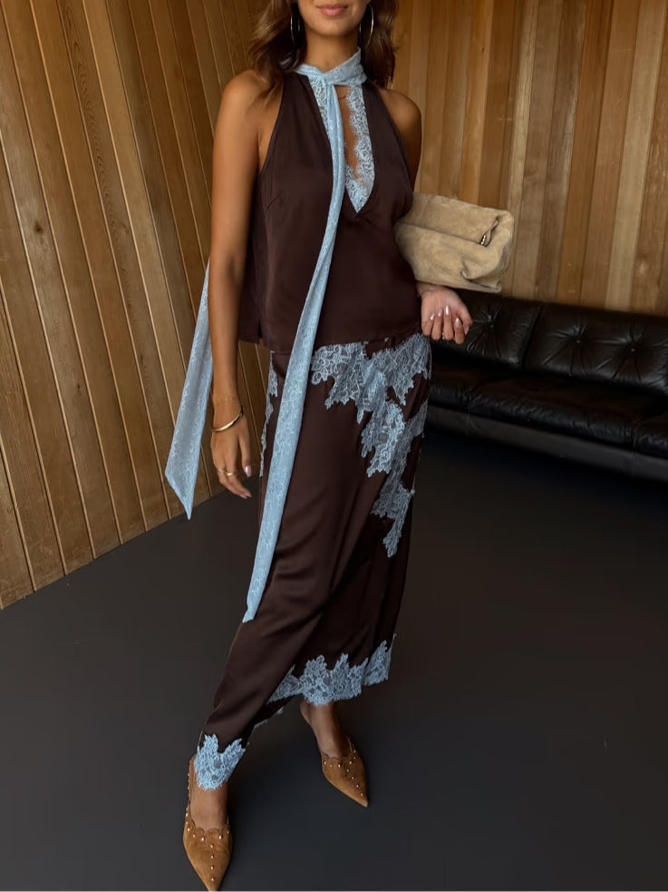 Sophisticated women's brown two-piece outfit with elegant lace panels on the top and a coordinating skirt.
