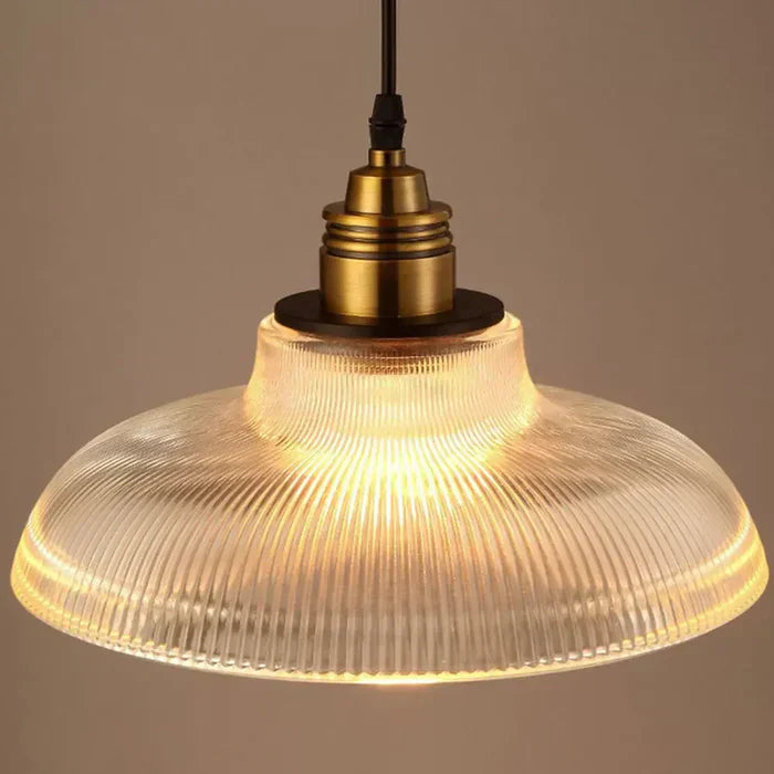 Decorative CrystalLoom glass pendant light with warm white glow, a stylish metal-glass ceiling fixture.