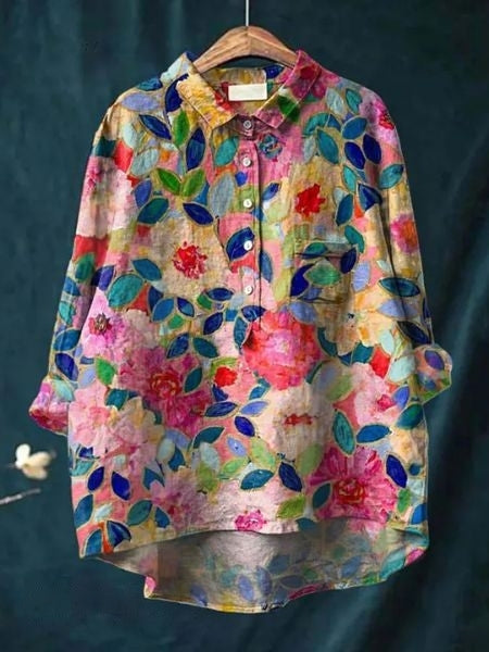 Elegant vibrant floral blouse, a comfortable and flowing women's top for versatile spring/summer fashion.
