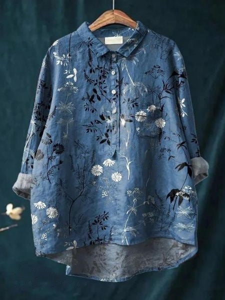 Woman wearing elegant flowing floral blouse, a versatile top for spring fashion.