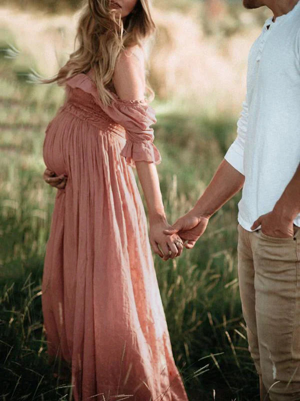 Elegant flowy off-shoulder maxi maternity dress for women. Comfortable pregnancy wear, ideal for baby showers & stylish moms.