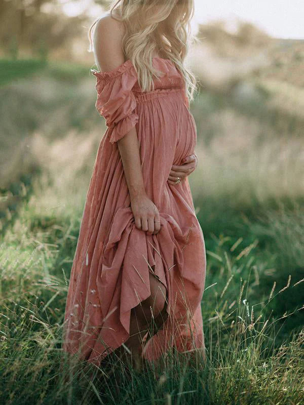 Stylish women's flowy off-shoulder maxi maternity dress. Comfortable pregnancy fashion, perfect for baby showers or events.
