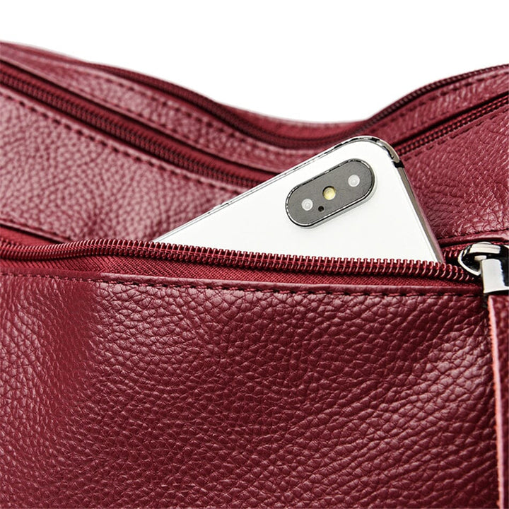 Luxury women's genuine leather crossbody, stylish and functional everyday bag.