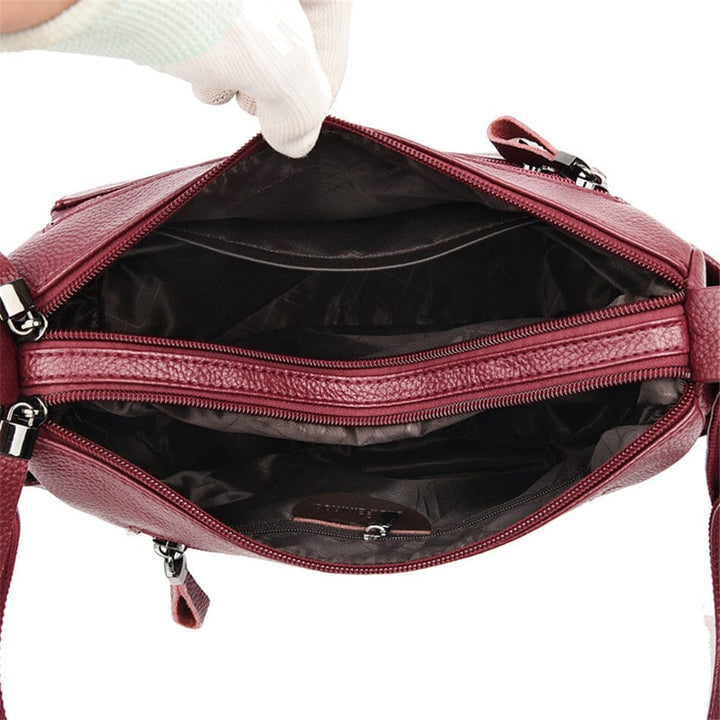 Versatile genuine leather shoulder bag, an elegant fashion accessory for women.