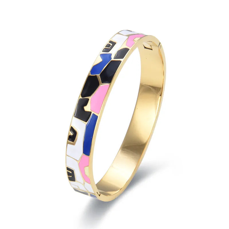Women's gold cuff bracelet with a captivating natural geode charm, an elegant fashion accessory.