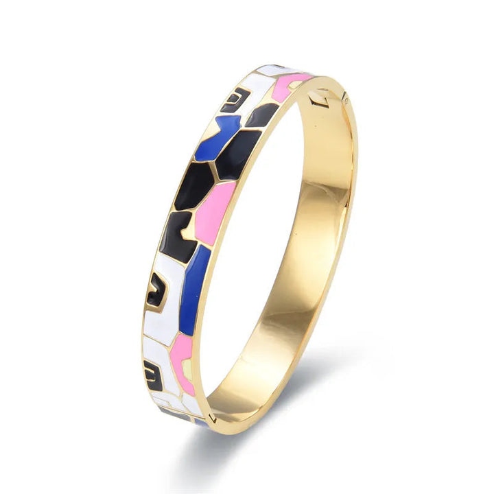 Women's gold cuff bracelet with a captivating natural geode charm, an elegant fashion accessory.