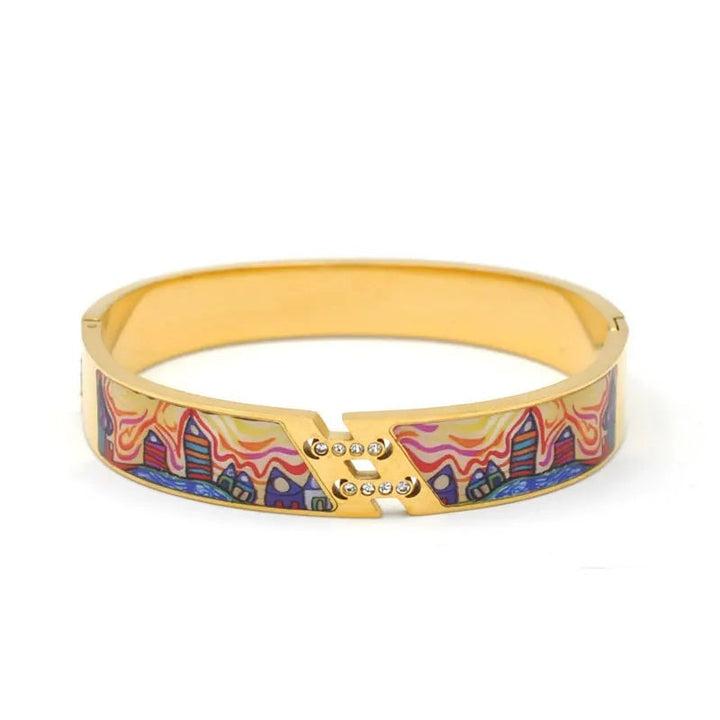 Elegant adjustable gold charm bracelet for women, featuring a striking natural geode stone.