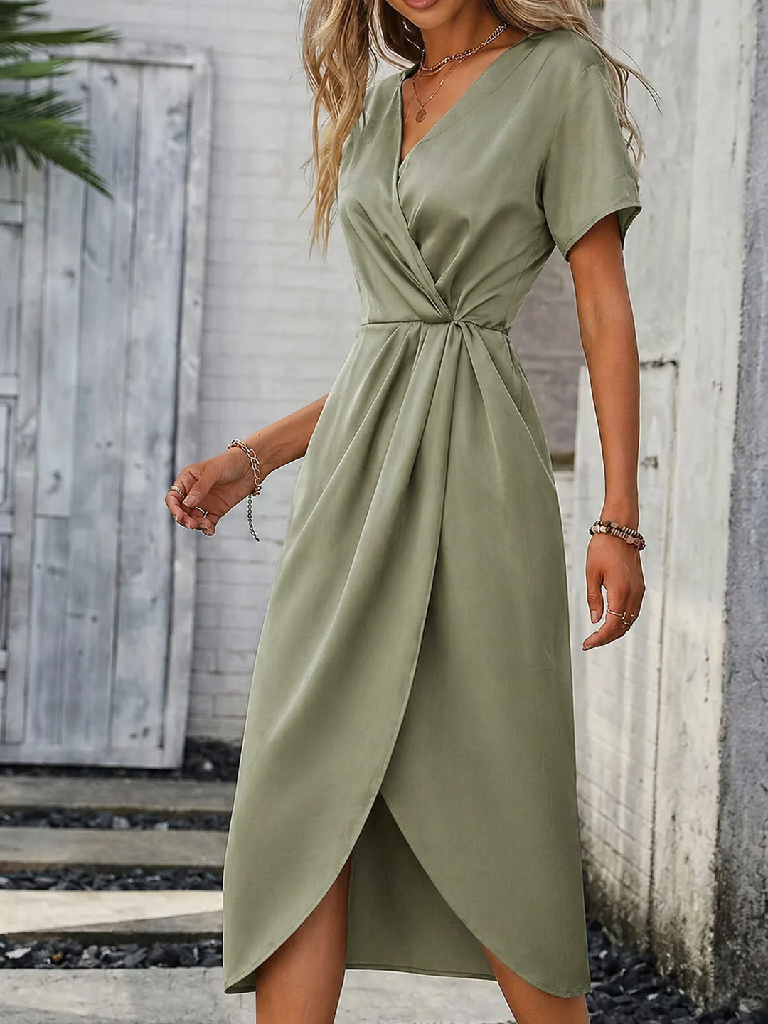 Chic women's green wrap midi dress with short sleeves & adjustable belt, an elegant choice for summer fashion.