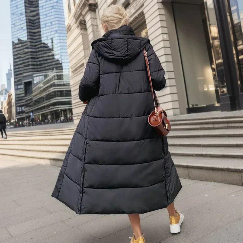 Women's elegant Isabella long winter coat, offering cozy comfort & chic style in cold weather.