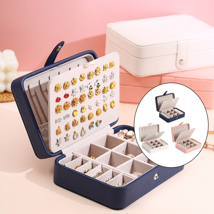 Blue leather flip-top jewelry box, a stylish and secure solution for women's precious items.