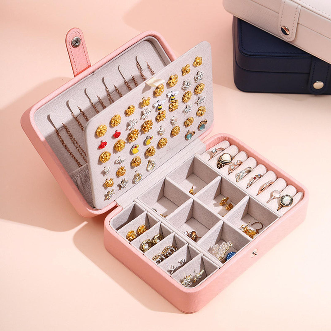 Compact flip-top travel jewelry organizer, a practical leather box for women's accessories.