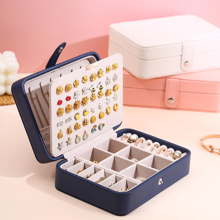 Multilayered flip-top leather jewelry storage box, neat organization for all her treasures.