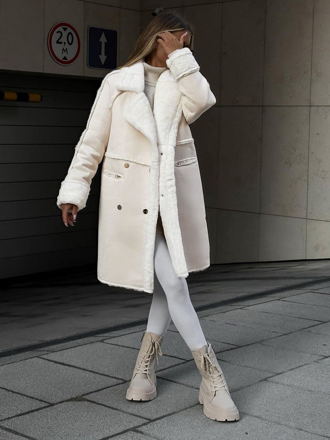 Elegant long polar fleece women's winter coat, chic and cozy, perfect for sophisticated winter style.