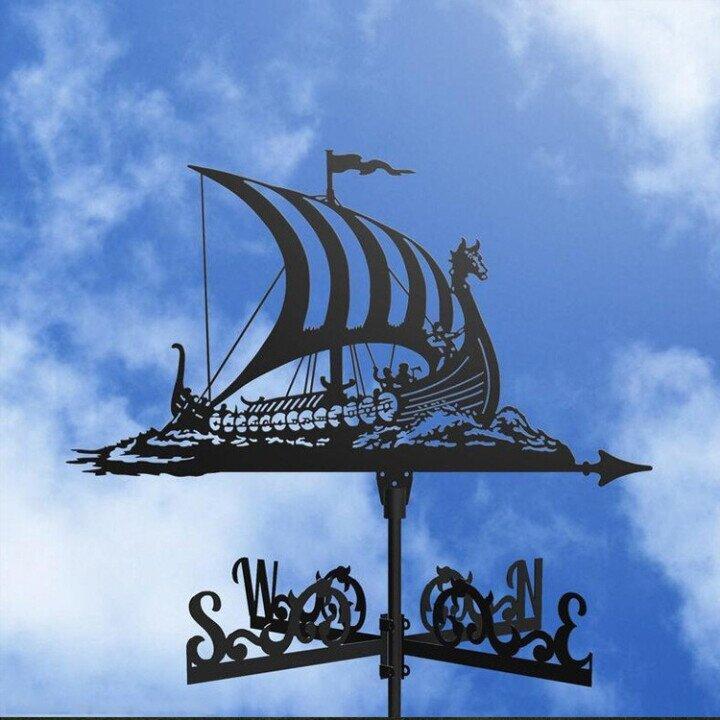 Artistic garden wind vane decor, an elegant directional indicator adding charm to any outdoor space.
